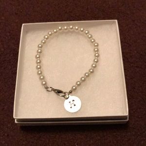 NIB pearl bracelet with H initial.